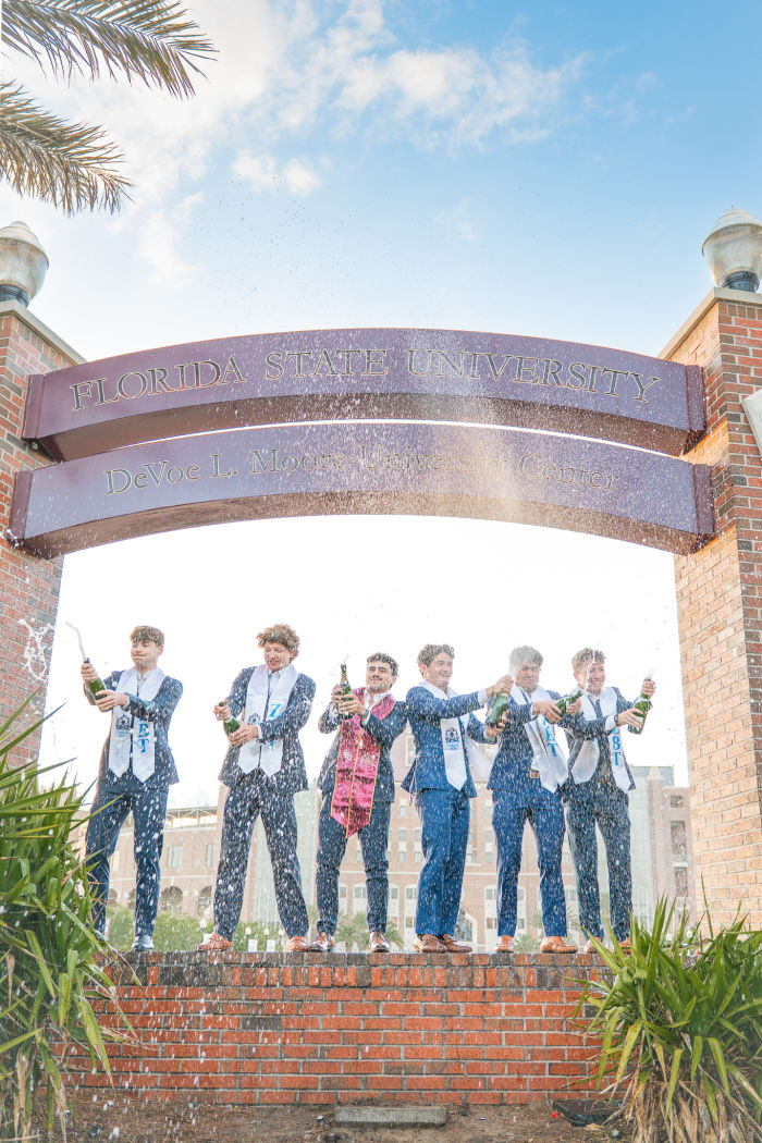 Champagne pop grad photo at FSU