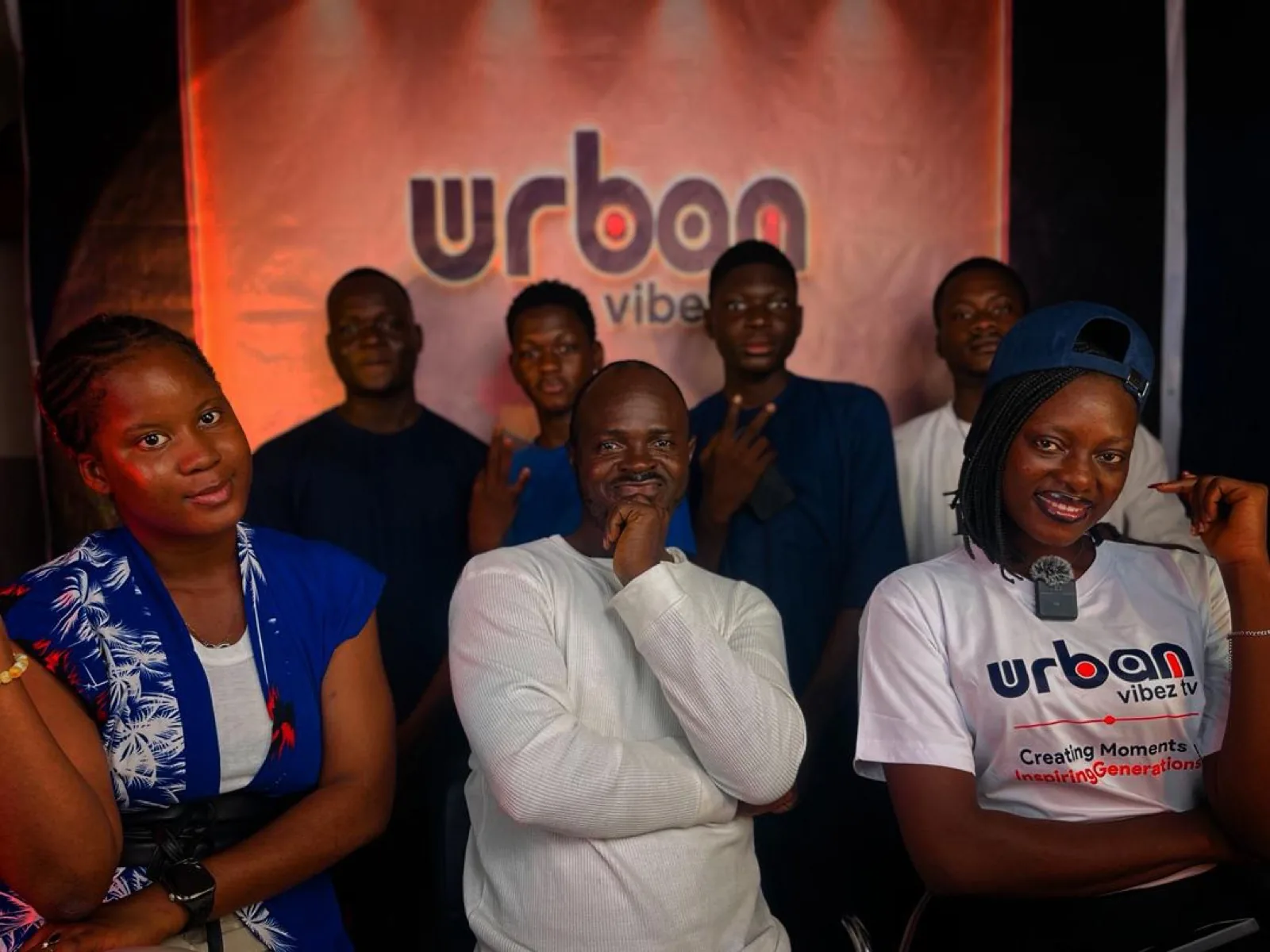 The Urban Vibez TV crew together at the backdrop