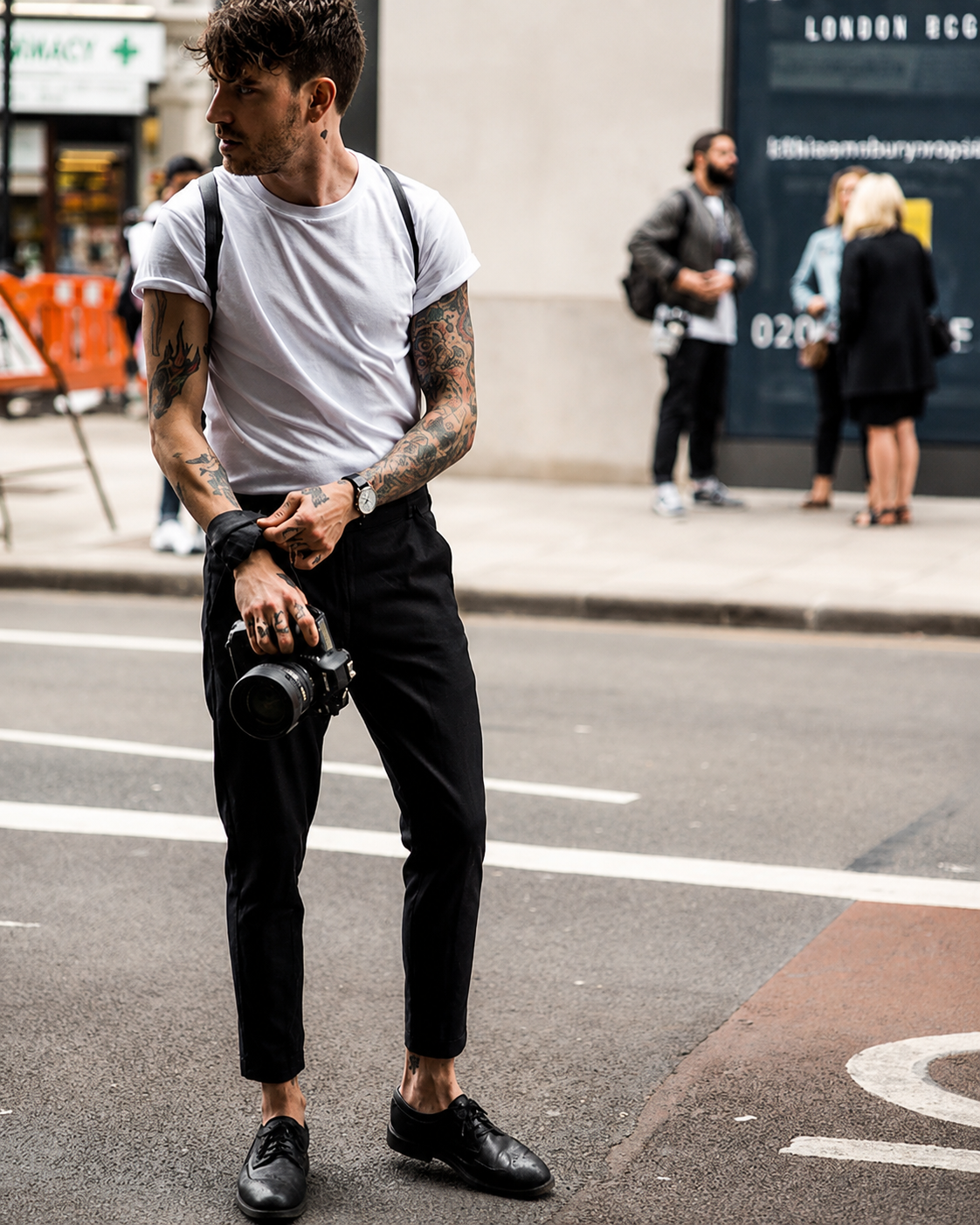 A man wearing a black tee