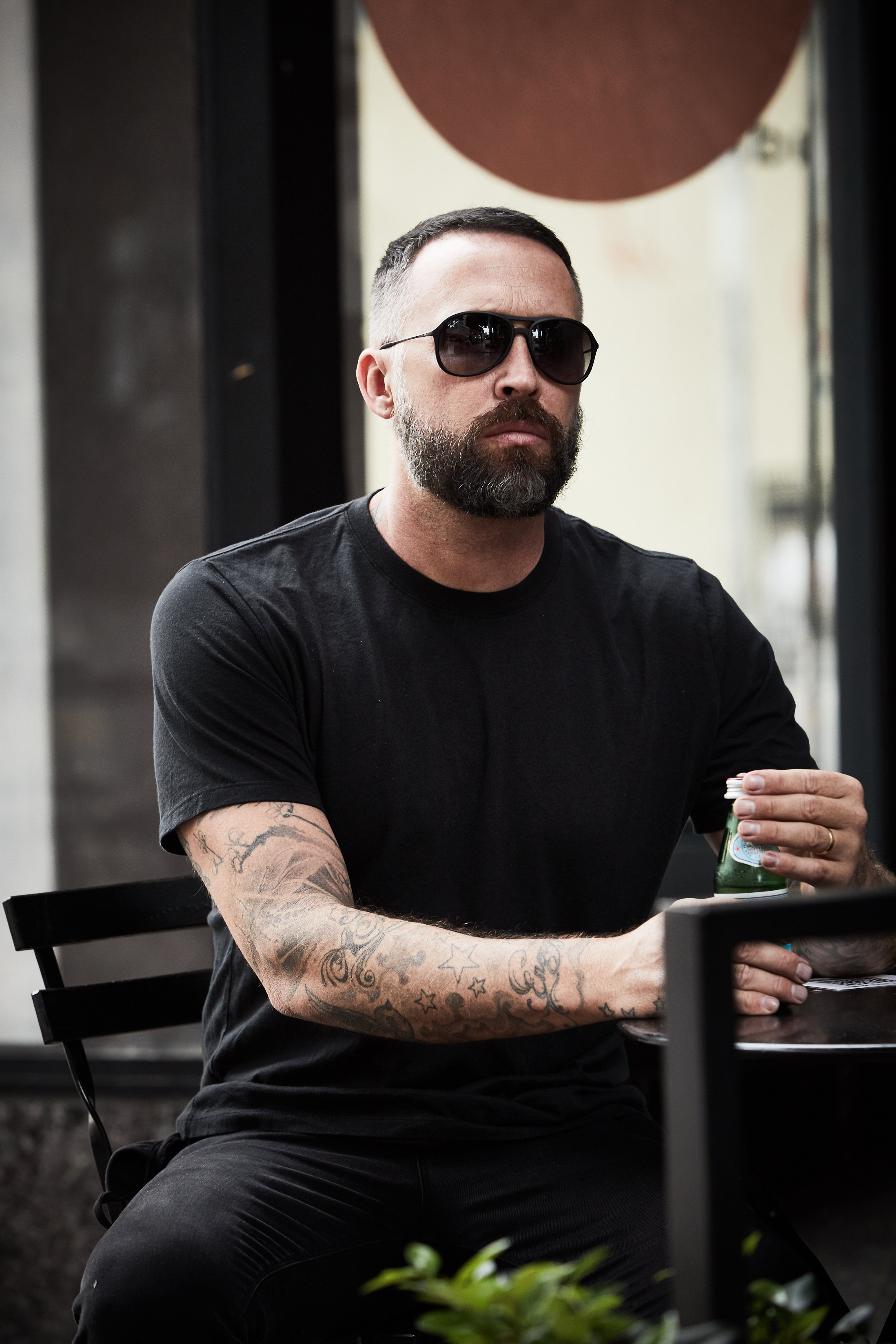 A man in a mocha t-shirt