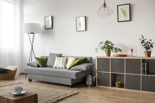 Which direction should hardwood flooring be laid?
