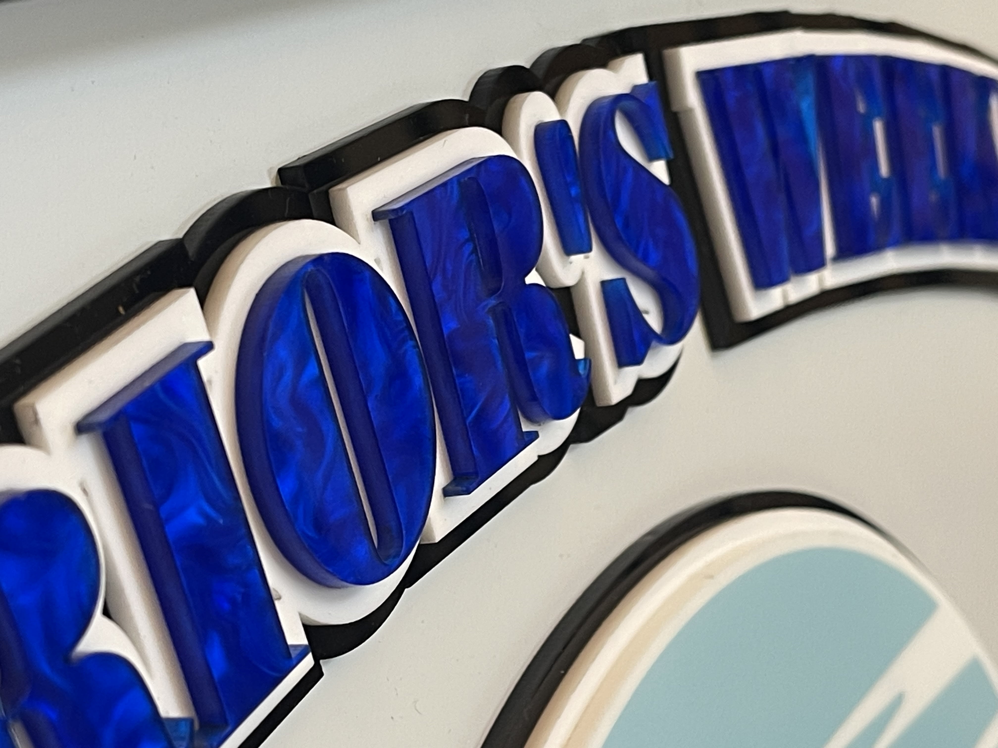 Custom layered acrylic sign closeup detail
