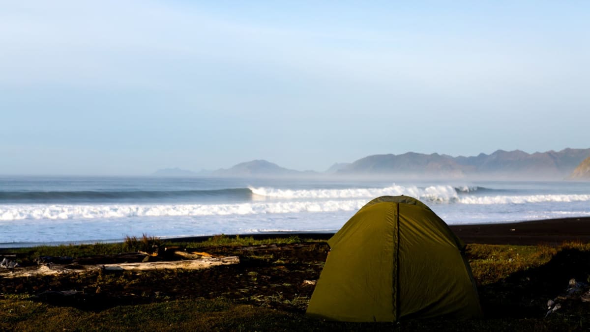 A tent on the wild coast of Kodiak Island in Alaska