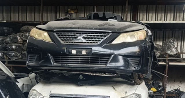 Black Toyota Mark X sedan front halfcut — hood, grille, bumper and headlights, Sharjah market