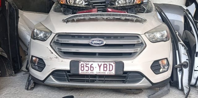 Off-white Ford Escape / Kuga SUV front halfcut — bumper, chrome grille and headlights, Sharjah market