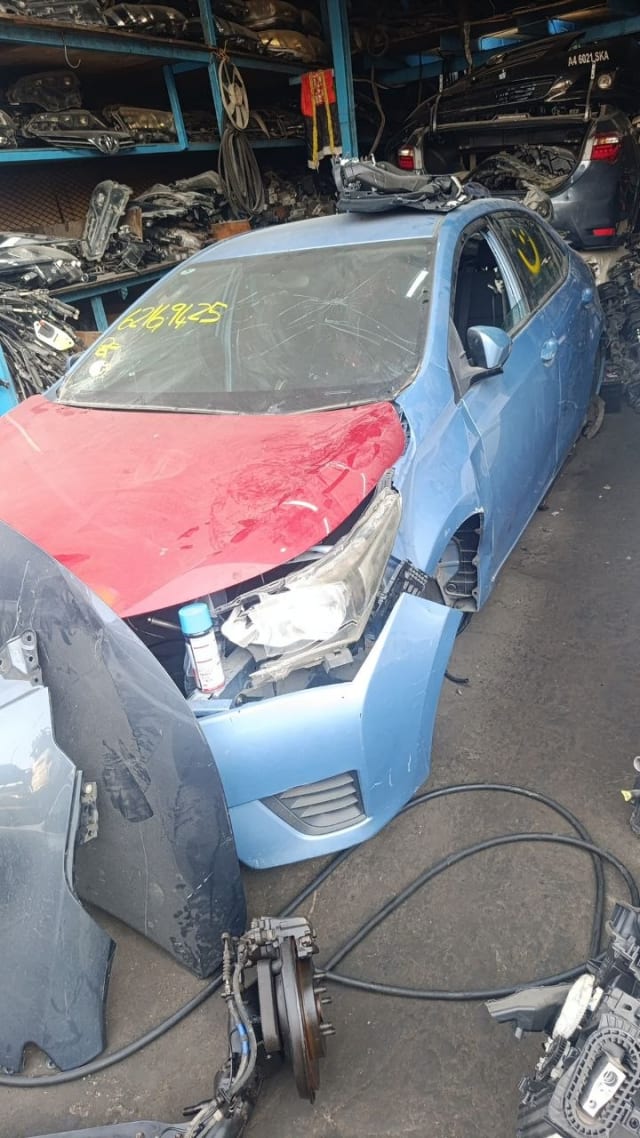 Blue Toyota Corolla sedan halfcut — front bumper, headlight, fender and doors, Sharjah market