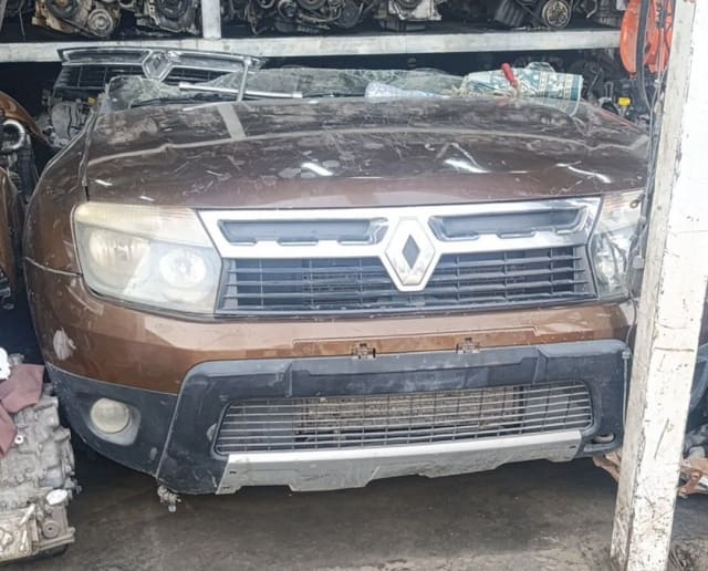 Brown Renault Duster SUV front cut — hood, headlights, grille and bumper, Sharjah market