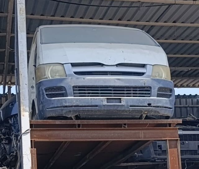 White Toyota Hiace van front halfcut — bumper, grille and headlights, Sharjah market
