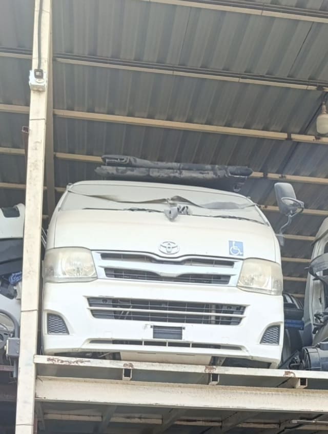 White Toyota Hiace van front cut — bumper, grille and headlights, Sharjah market
