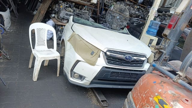 White Subaru Forester front halfcut — bumper, chrome grille and fog lights, Sharjah market