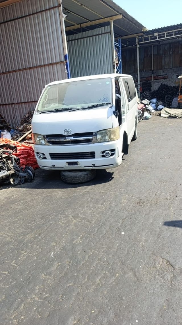 White Toyota Hiace van front cut — bumper, grille, headlights and windshield, Sharjah market