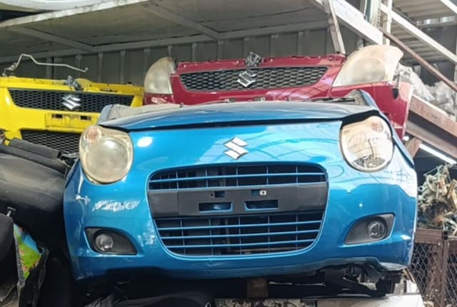 Blue Suzuki Alto front cut — bumper, grille and headlights, Sharjah market