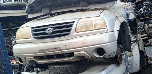 Silver Suzuki Grand Vitara SUV front halfcut — bumper, grille and headlight, Sharjah market