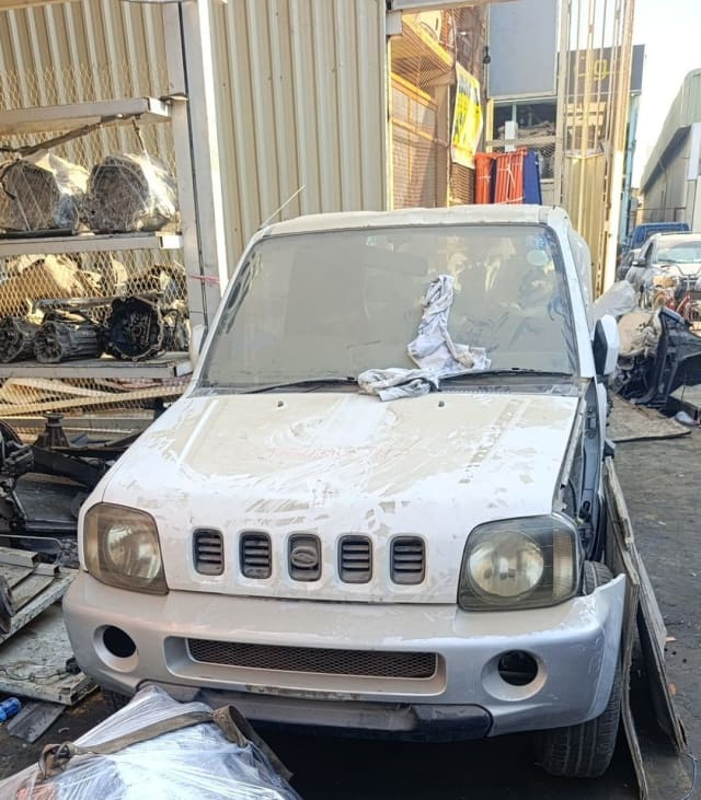 White Suzuki Jimny SUV front — bumper, grille, headlights and hood, Sharjah market