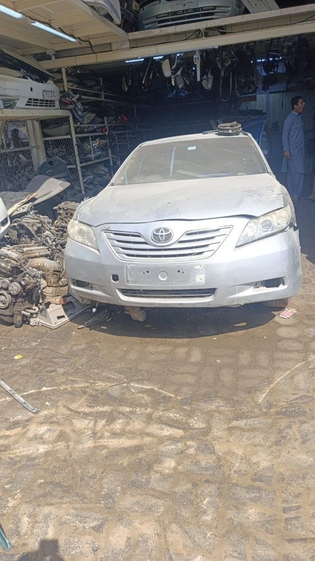 Silver Toyota Camry sedan front halfcut — bumper, grille, headlights and hood, Sharjah market