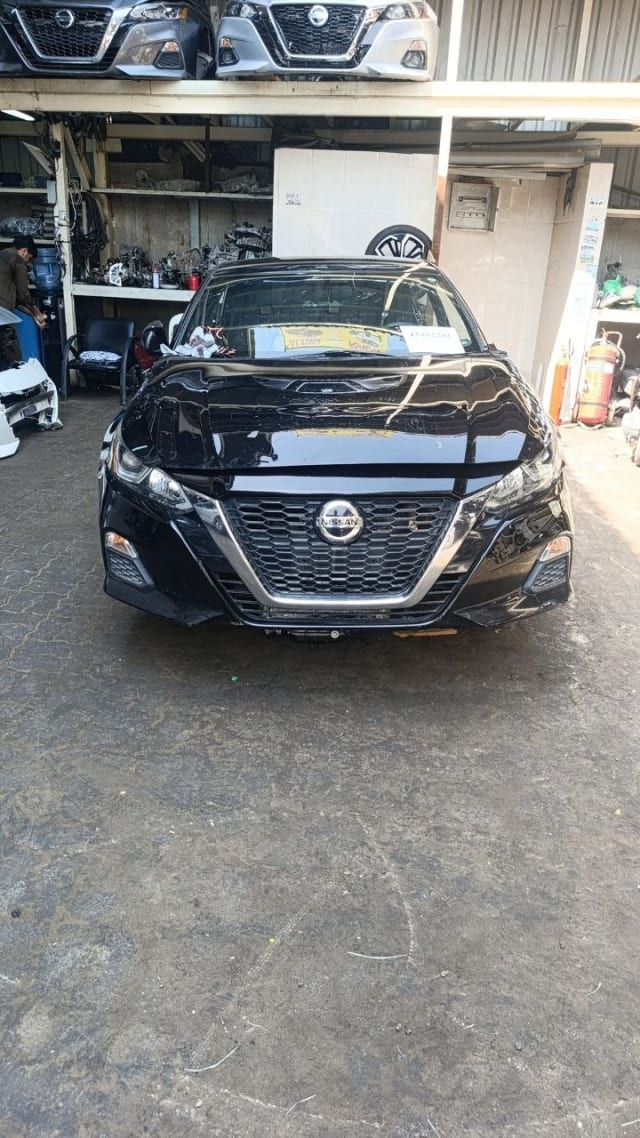 Black Nissan Altima sedan front end for parts — grille, headlights, hood and bumper, Sharjah market