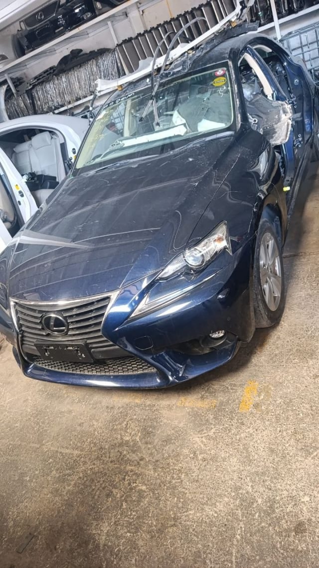 Dark blue Lexus IS sedan front — grille, bumper, headlights and hood, car for parts, Sharjah market