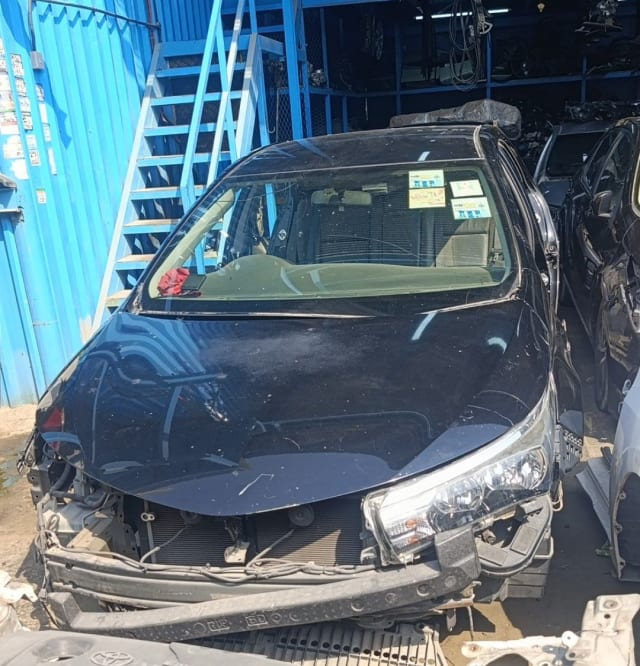 Dark blue Toyota Corolla sedan halfcut — hood, headlight and radiator support, Sharjah market