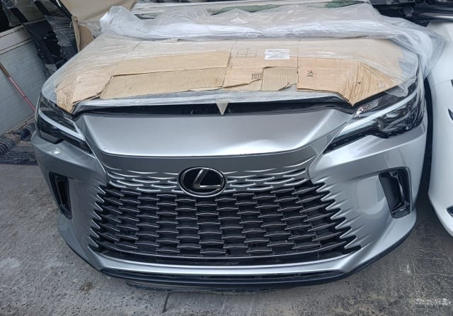 Silver Lexus RX front halfcut — spindle grille, bumper and headlights, Sharjah market