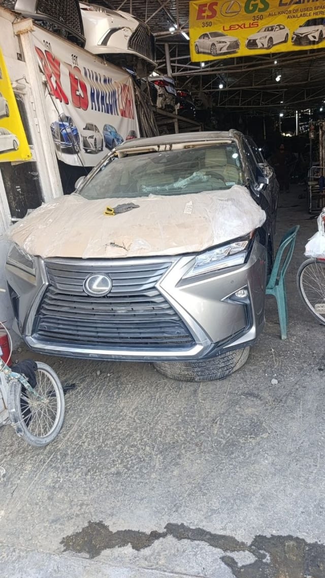 Dark grey Lexus RX SUV car for parts — front grille, bumper and headlights, Sharjah market