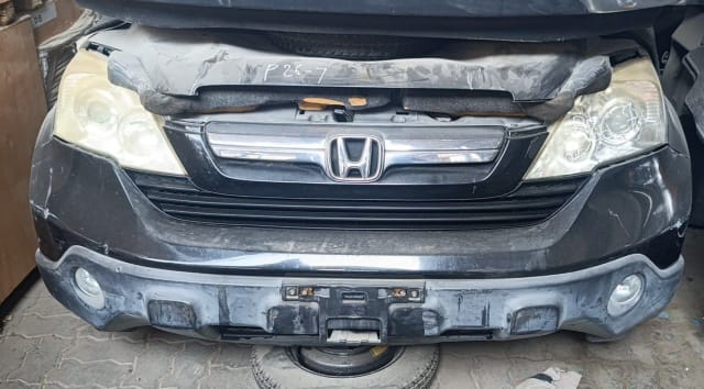 Black Honda CR-V SUV front cut — bumper, grille, headlights and fog lights, Sharjah market