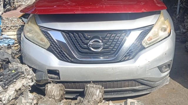 Silver Nissan Murano SUV front cut — bumper, chrome grille and headlights with red hood, Sharjah market