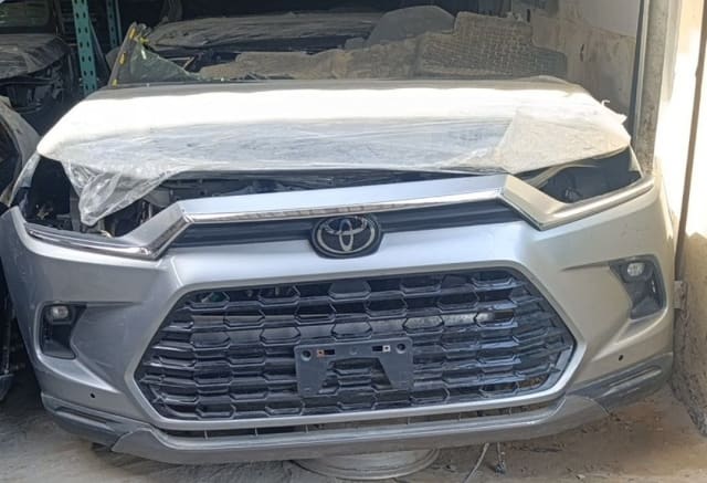 Silver Toyota Rush front cut — front bumper, grille and Toyota emblem, Sharjah market