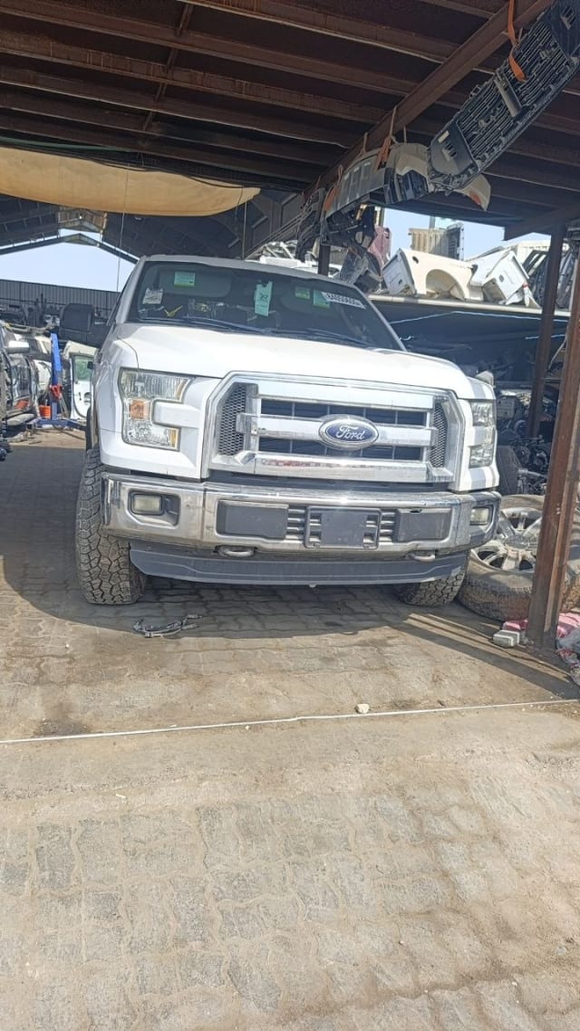 White Ford F-150 pickup front cut — grille, headlights and front bumper, Sharjah market