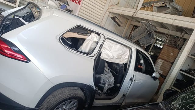 White Toyota RAV4 side halfcut — doors, wing mirror, tail light and alloy wheel, Sharjah market