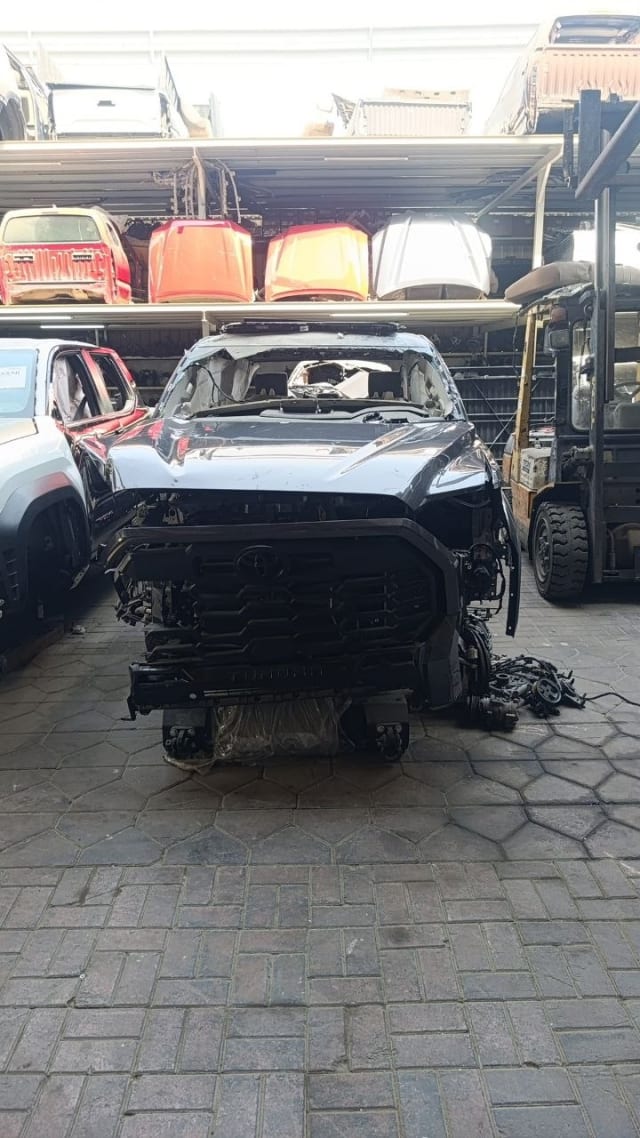 Dark grey Toyota Tundra pickup front halfcut — hood, fenders and grille exposed, Sharjah market