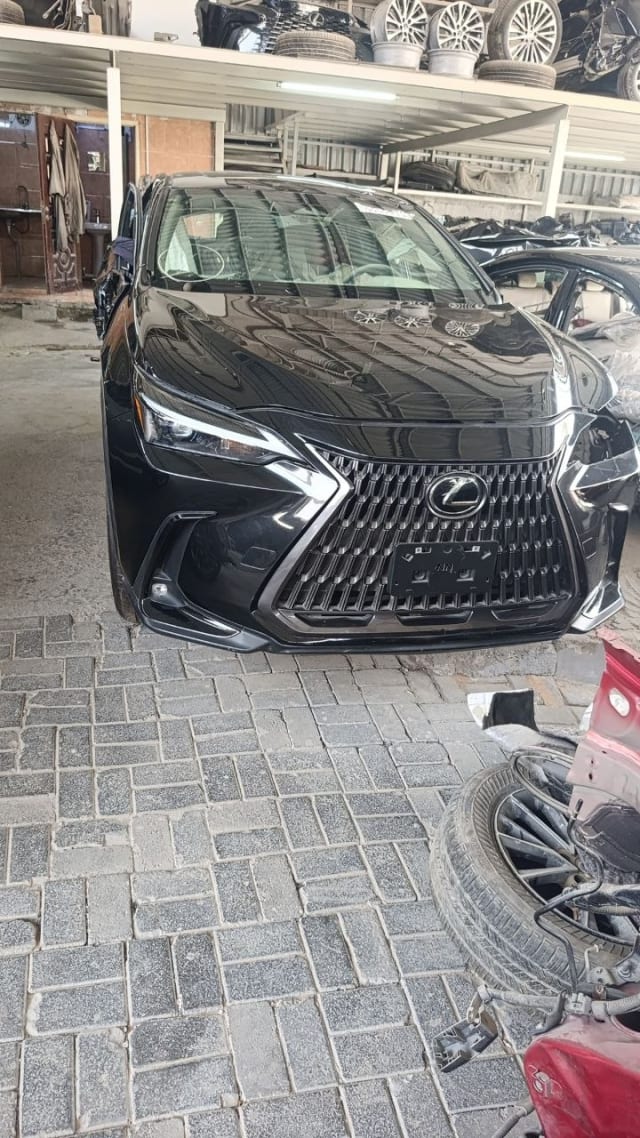 Black Lexus NX SUV front — spindle grille, LED headlights, bumper and hood, Sharjah market