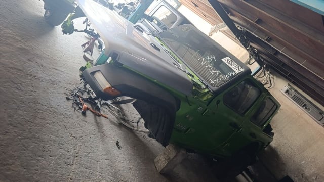 Green Jeep Wrangler SUV halfcut — front bumper, fender, door and cabin, Sharjah market