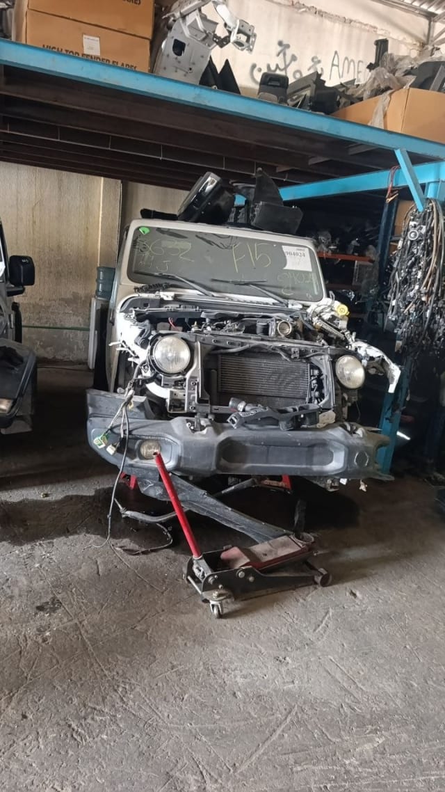 White Suzuki Jimny front halfcut — headlights, radiator, bumper and engine bay, Sharjah market