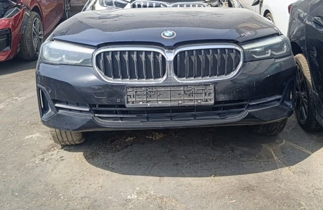 Dark grey BMW 5-Series sedan front cut — hood, kidney grille, LED headlights and bumper, Sharjah market