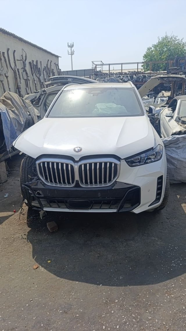 White BMW X5 SUV front cut — hood, kidney grille, LED headlights and front bumper, Sharjah market