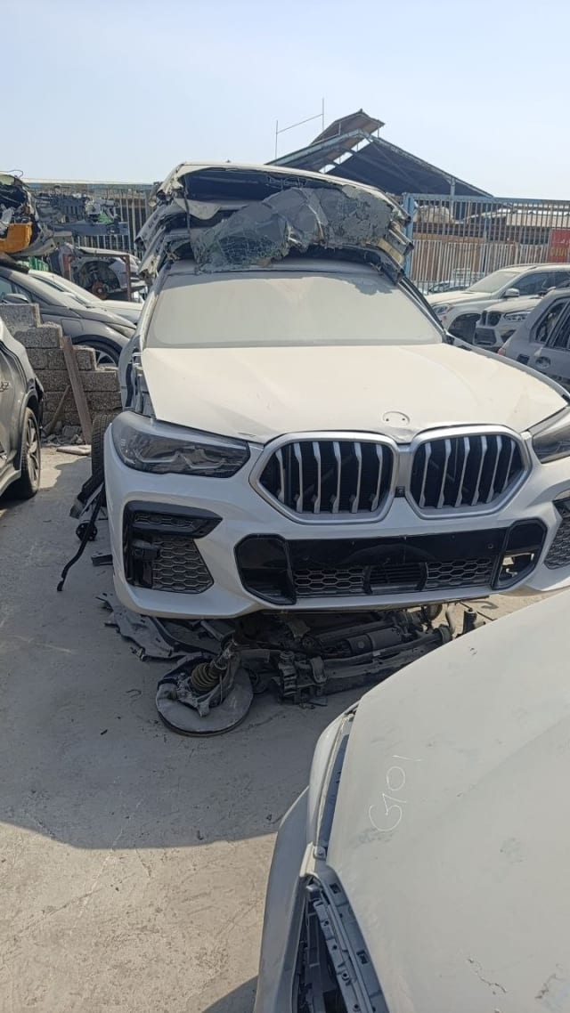 White BMW X6 SUV coupe front halfcut — kidney grille, headlights and front bumper, Sharjah market