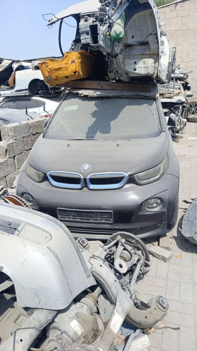 Dark grey BMW i3 hatchback front cut — bumper, kidney grille and headlights, Sharjah market