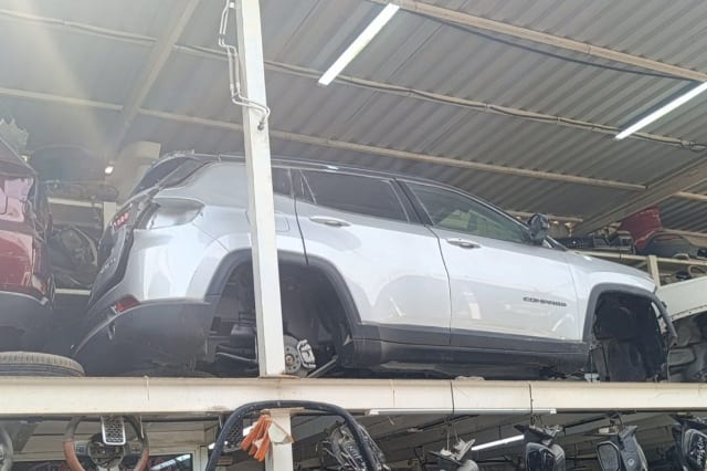 Silver Jeep Compass SUV halfcut side view — doors, quarter panel and tailgate, Sharjah market