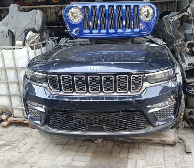 Dark blue Jeep Grand Cherokee front halfcut — grille, hood, bumper and headlights, Sharjah market