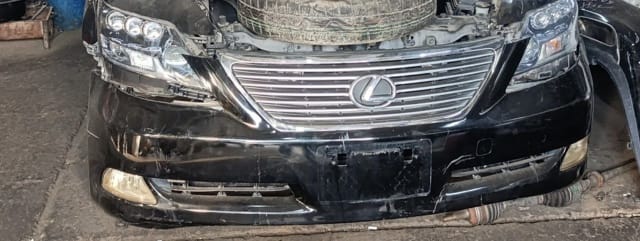 Black Lexus LS460 sedan front cut — bumper, chrome grille, headlights and fog lights, Sharjah market