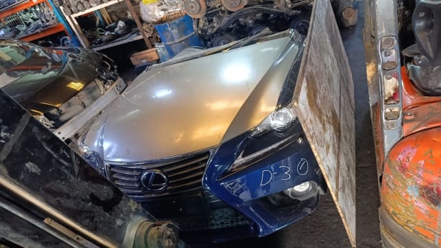 Dark blue Lexus IS sedan halfcut — spindle grille, headlight, bumper and hood, Sharjah market