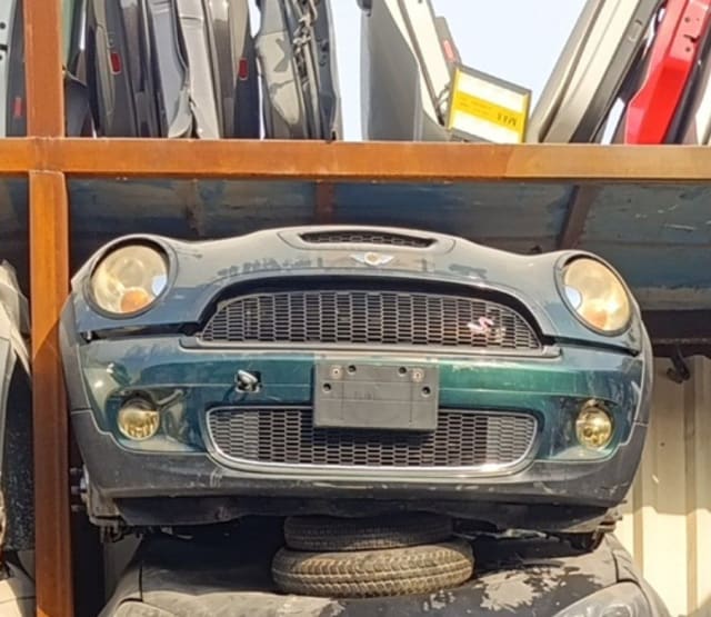 Green MINI Cooper S hatchback front cut — bumper, grille, headlights and fog lights, Sharjah market