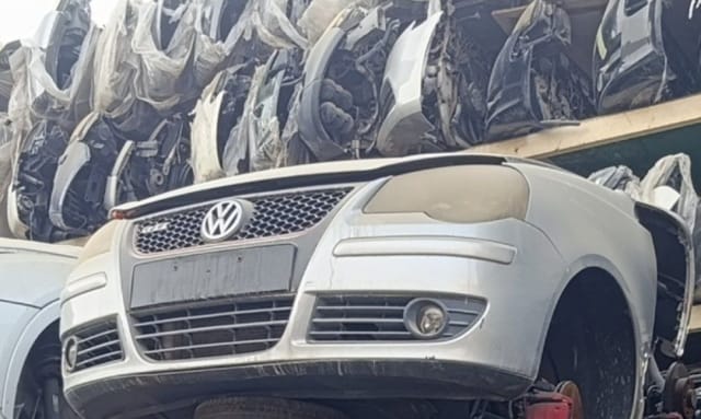 Silver Volkswagen Polo GTI front cut — bumper, grille, VW badge and headlight, Sharjah market