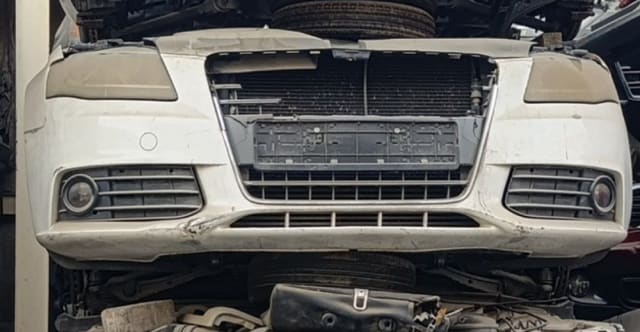 White Audi A4 front cut — bumper, grille, fog lights and radiator support, Sharjah market