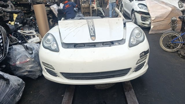 White Porsche Panamera front halfcut — hood, bumper, grille and headlights, Sharjah market