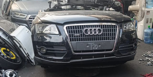 Black Audi Q5 SUV front halfcut — grille, headlights, front bumper and hood, Sharjah market