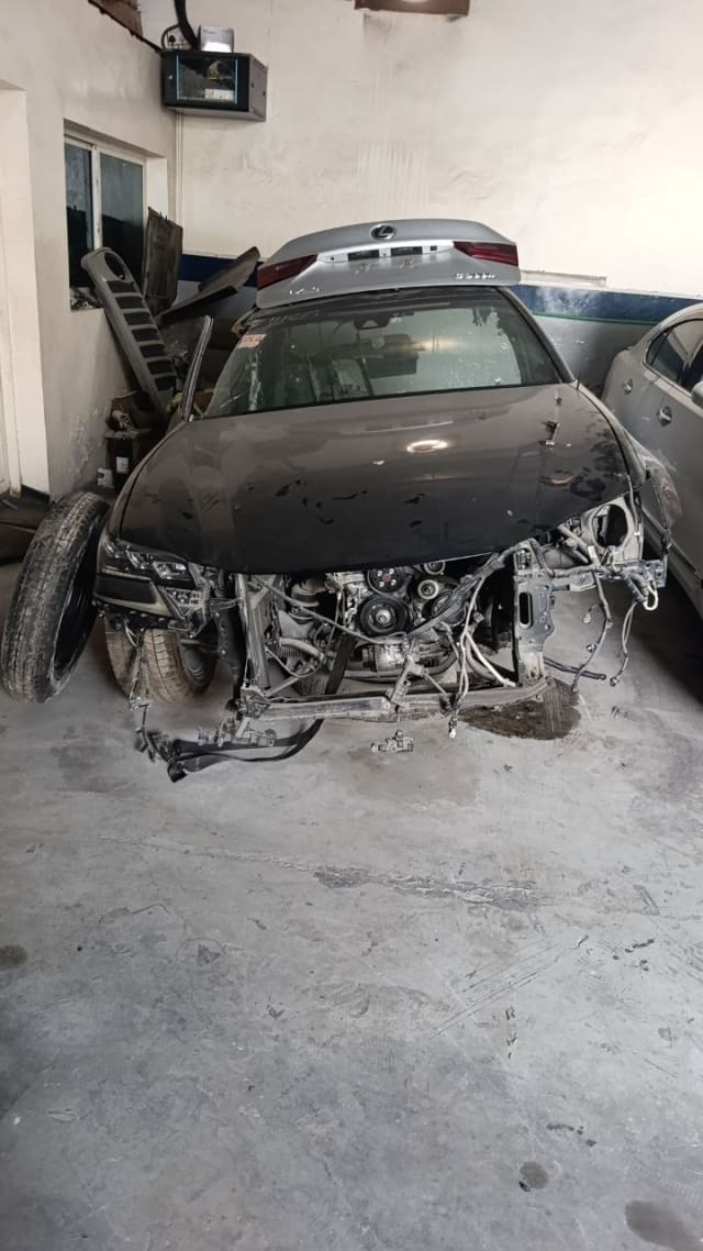 Dark brown Lexus GS sedan halfcut — hood, headlights and exposed engine bay, Sharjah market
