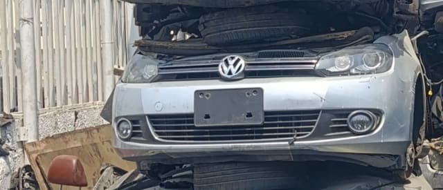Silver Volkswagen Golf hatchback front halfcut — bumper, grille, headlights and fog lights, Sharjah market