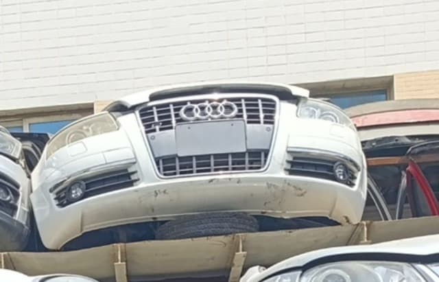 White Audi A8 front cut — single-frame grille, headlights and front bumper, Sharjah market