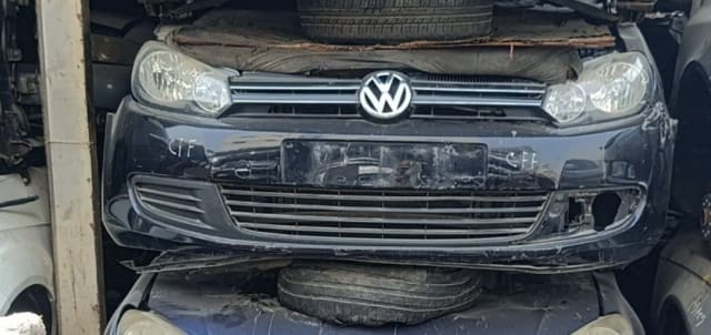 Dark blue Volkswagen Golf hatchback front cut — bumper, grille and headlights, Sharjah market